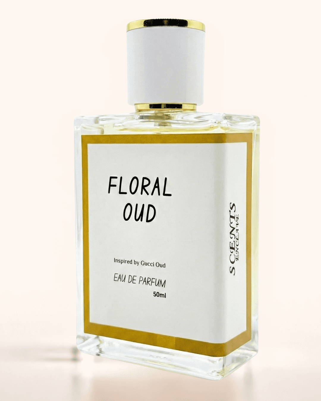 Floral Oud 50ml, Scents Enclave — clear bottle with a gold-rimmed cap, white label inside a gold border