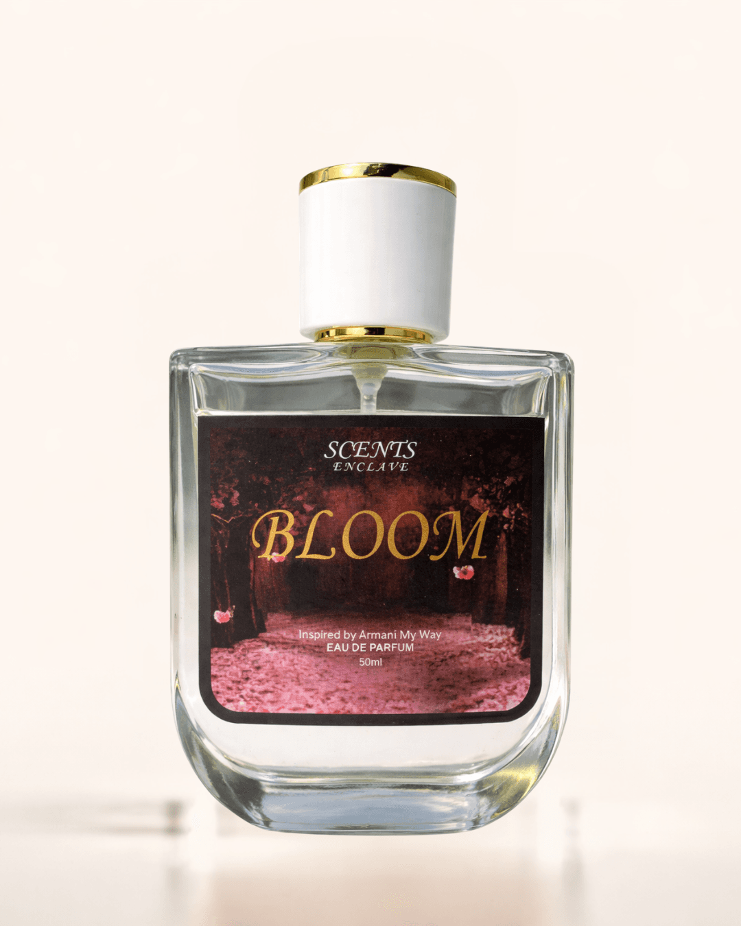 Bloom 50ml, Scents Enclave — clear bottle with a gold-rimmed cap and a burgundy floral label
