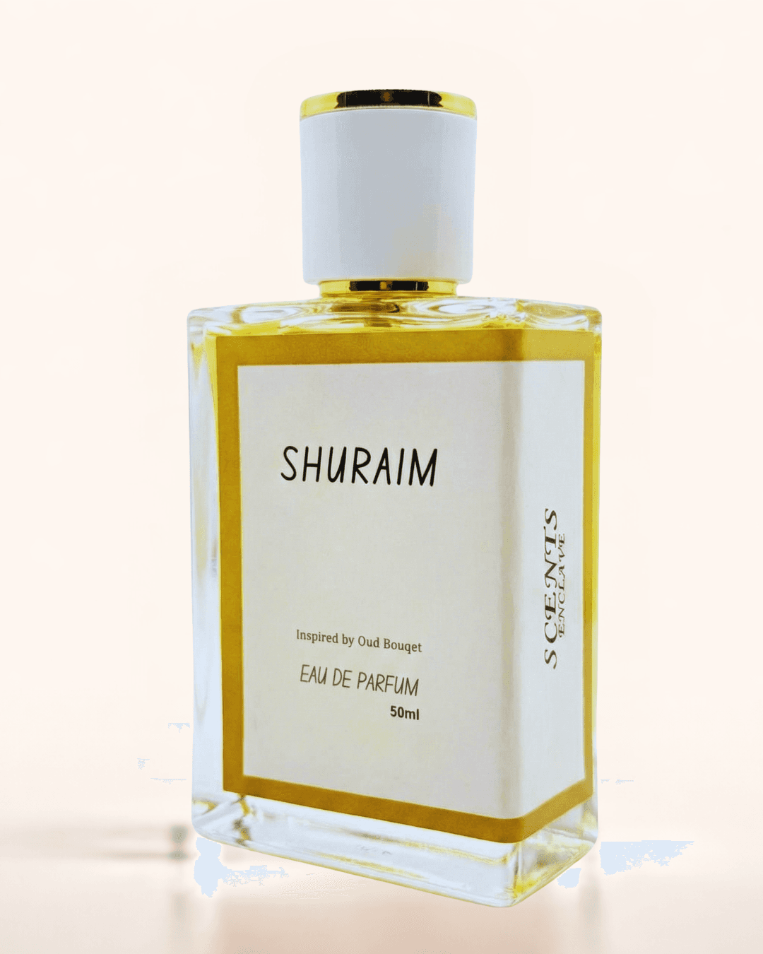 Shuraim 50ml, Scents Enclave — clear bottle with a gold-rimmed cap, white label inside a gold border