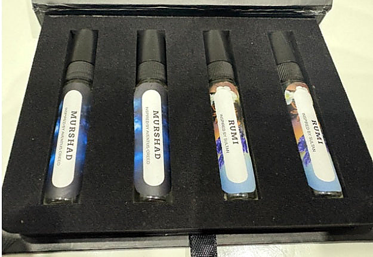 Tester Set, Scents Enclave — open black presentation box holding four sample sprays labelled Murshad and Rumi